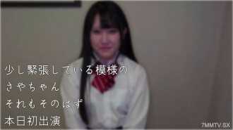 19-year-old with black hair and net on face looks satisfied